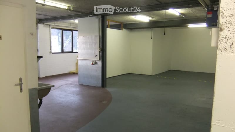 Empty room with bare walls, concrete floor, and a single window. No furniture or equipment present.