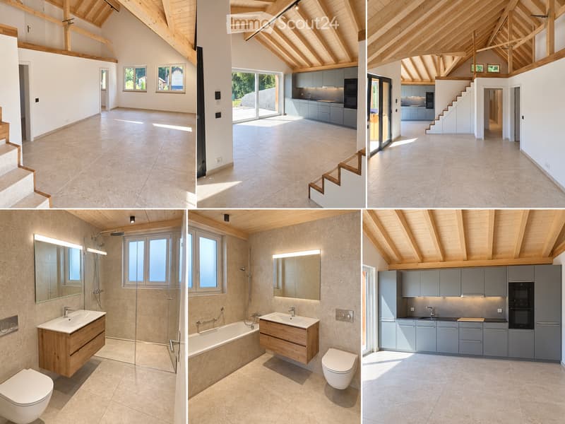 Modern house with exposed wooden beams, large windows, and open-plan living space. Includes a kitchen with grey cabinets, a bathroom with a bathtub, sink, and toilet, and a staircase leading to an upper level.