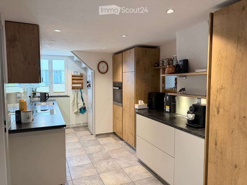 {"type": "Kitchen", "objects": ["coffee maker", "oven", "cupboard", "sink", "faucet", "clock", "cup", "cupboard", "cupboard", "cupboard", "cupboard", "cupboard", "cupboard", "cupboard", "cupboard", "cupboard", "cupboard", "cupboard", "cupboard", "cupboard
