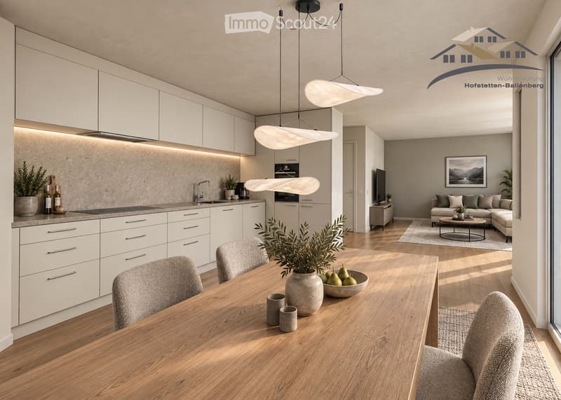 Open-plan kitchen and living area with modern white cabinets, pendant lights, a wooden dining table with chairs, a grey sofa, coffee table, and a television. The kitchen features a sink, faucet, and induction cooktop, with decorative plants and a vase on