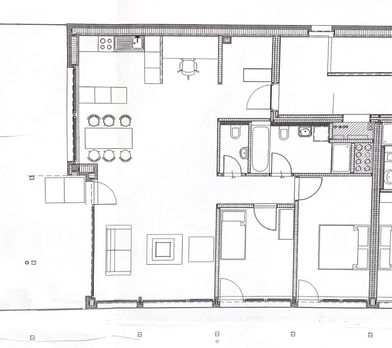 Floor plan of a residential space featuring a living room, dining area, kitchen, two bedrooms, and two bathrooms.
