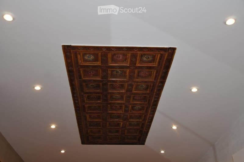 white ceiling, brown wooden panels, recessed lighting