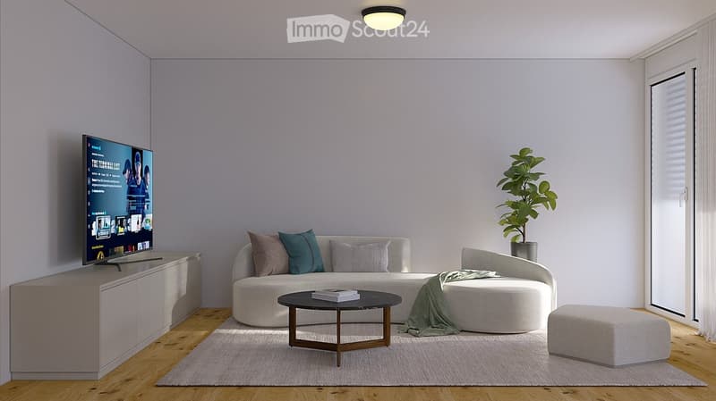 Modern living room with a curved sofa, coffee table, ottoman, wall-mounted TV, and a potted plant near the window.