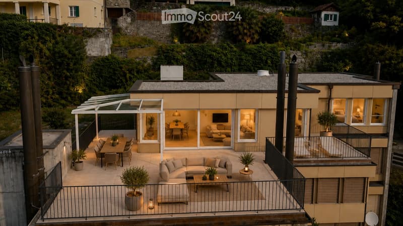 Modern rooftop terrace with a living area, dining area, and outdoor seating, surrounded by greenery and neighboring buildings.