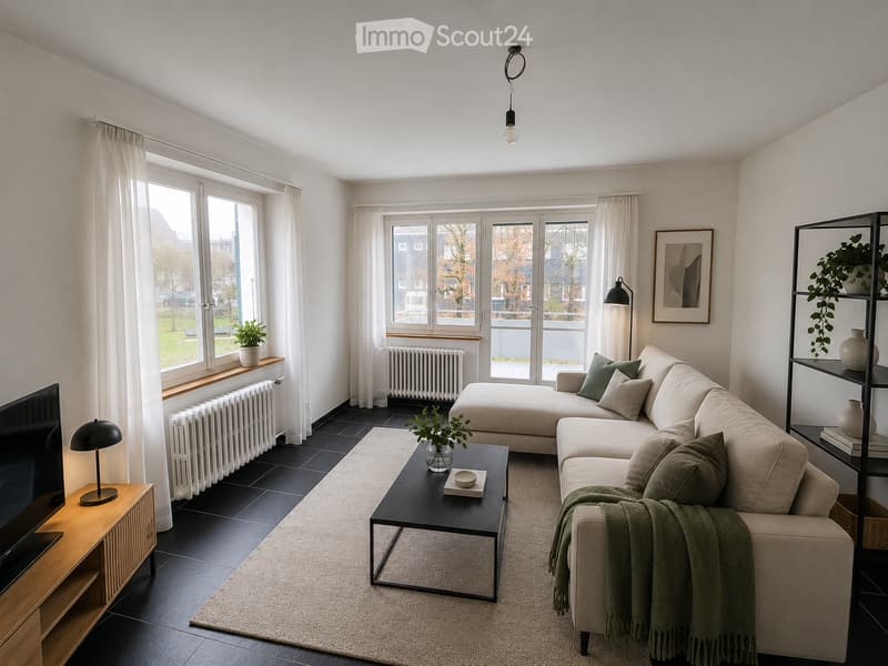 Modern living room with a light-colored sectional sofa, coffee table, TV, floor lamp, and decorative plants. Large windows with white curtains provide natural light.