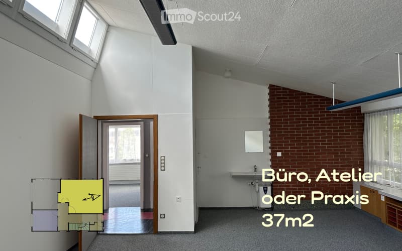Empty room with a brick wall, a sink, a mirror, and windows.