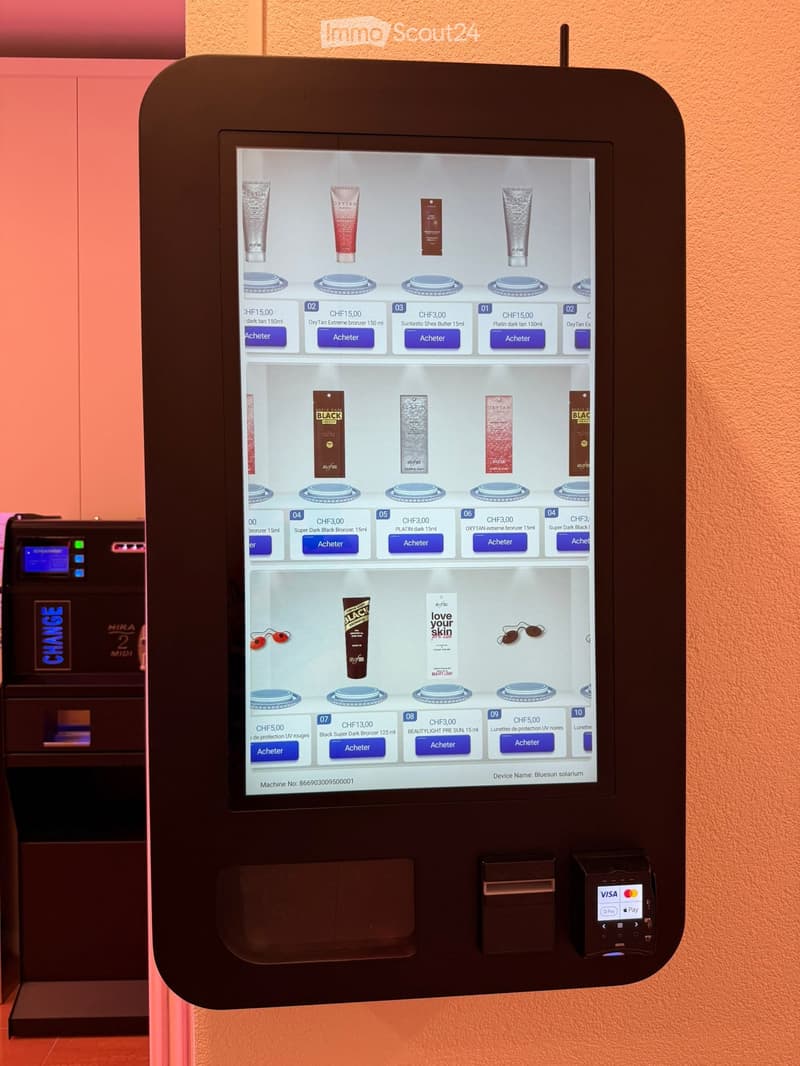 A touchscreen vending machine displaying various skincare products with purchase options and payment terminals.
