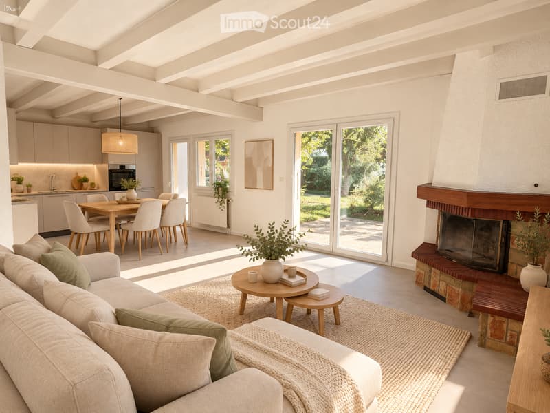 Bright, open-plan living and dining area with a fireplace, sofa, coffee table, dining table, and modern kitchen.