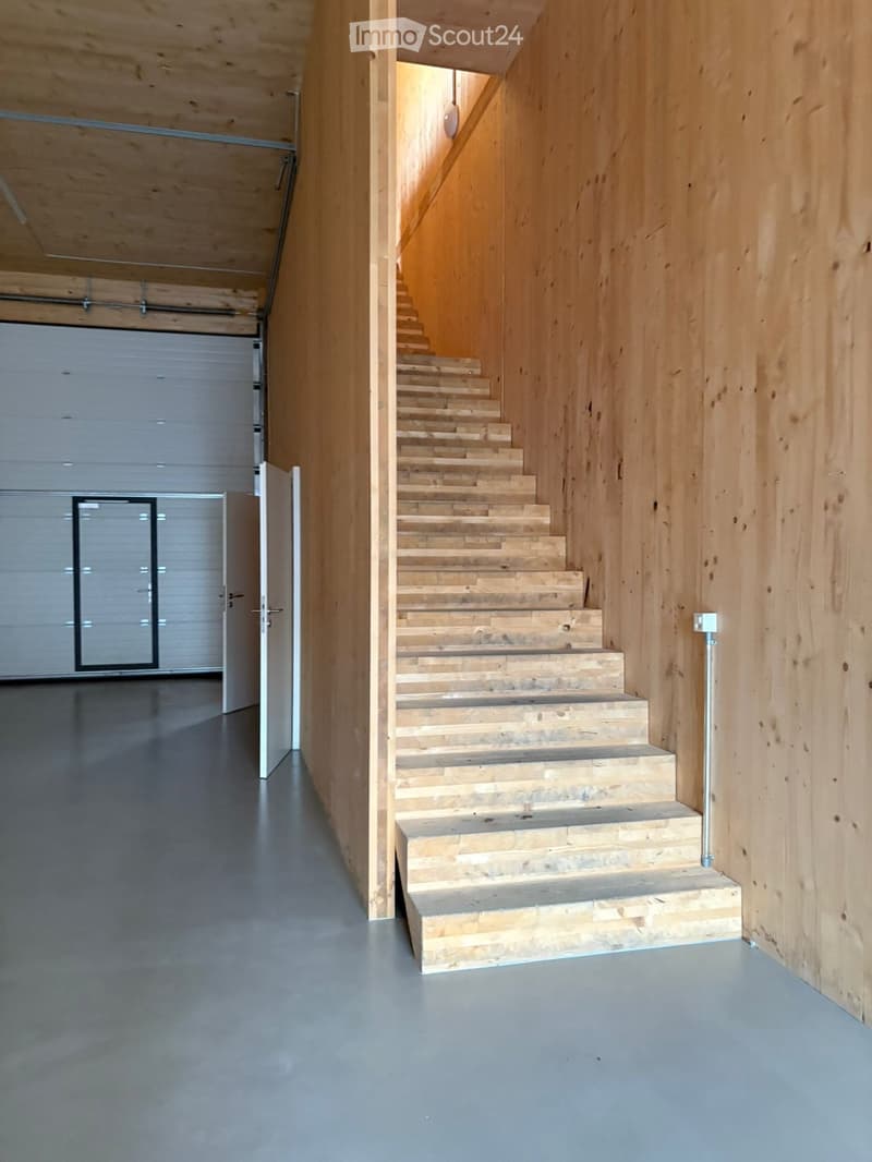 wooden floor, wooden stairs, industrial-style walls, concrete flooring