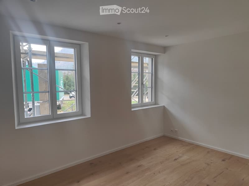 empty room, large windows, wooden floor