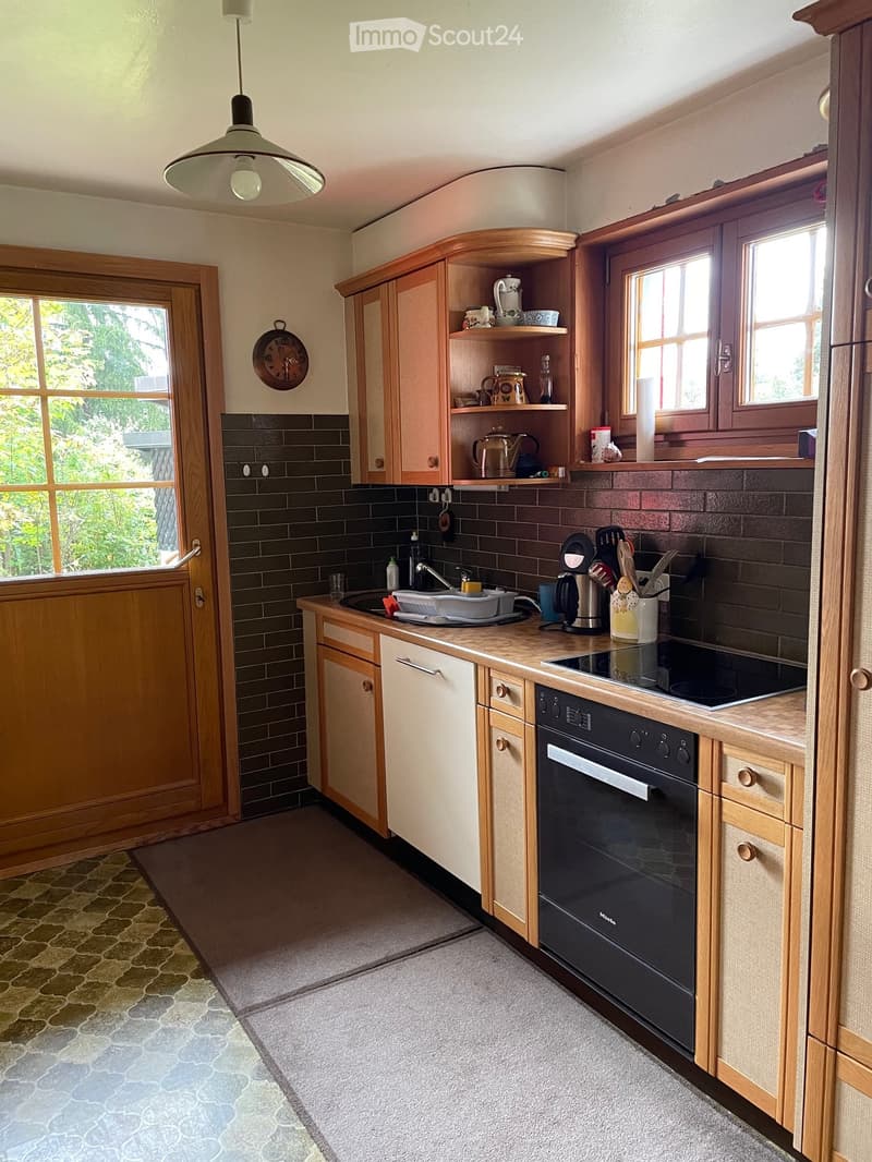 {"type": "Kitchen", "objects": ["sink", "faucet", "oven", "coffee maker", "teapot", "cupboard", "clock", "oven", "induction stove", "cupboard", "cupboard", "cupboard", "cupboard", "cupboard", "cupboard", "cupboard", "cupboard", "cupboard", "cupboard", "cu
