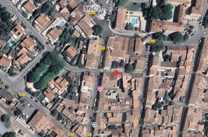 The image shows an aerial view of a neighborhood, including streets, residential buildings, commercial establishments, and green spaces. Notable landmarks include a swimming pool, a restaurant, and a bar.