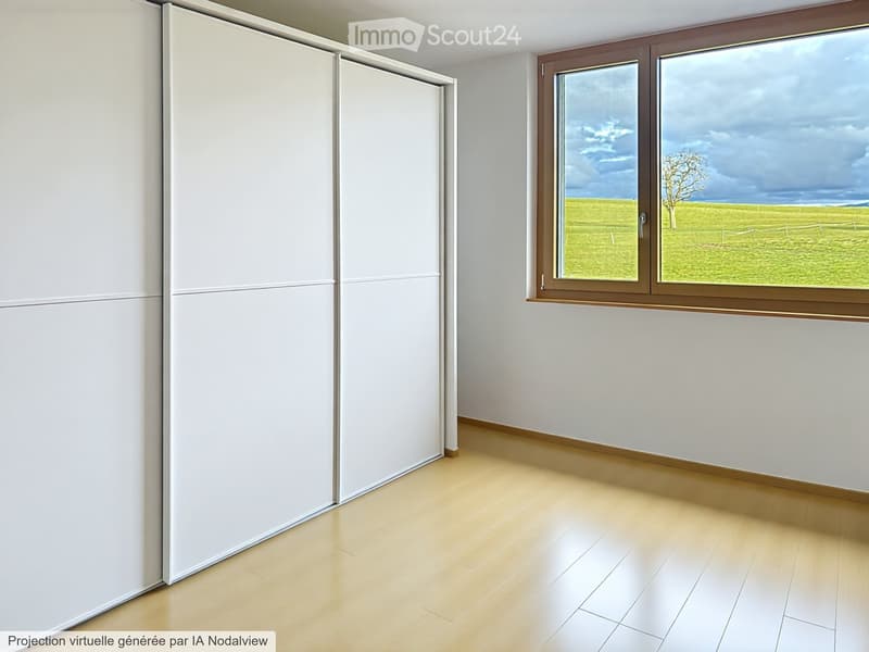 Empty room with light wooden flooring, white walls, large window with brown frame, and white sliding doors.