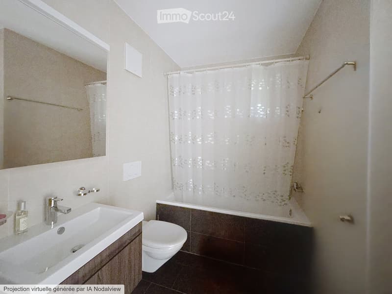 Modern bathroom with a white sink, chrome faucet, toilet, bathtub with a floral shower curtain, and a large mirror above the sink.