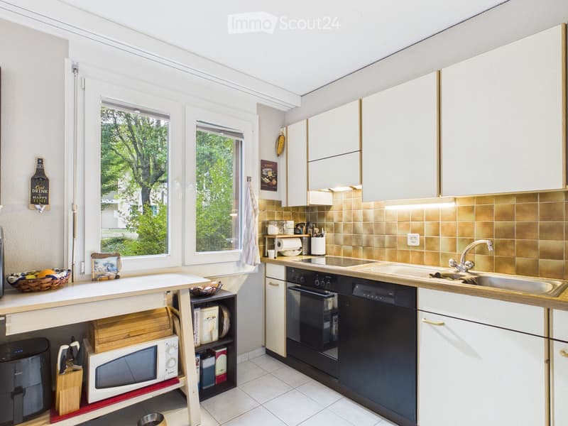 {"type": "Kitchen", "objects": ["sink", "faucet", "oven", "dishwasher", "microwave", "cupboard", "bowl", "framed picture", "towel", "cupboard", "faucet", "faucet", "oven", "dishwasher", "microwave", "cupboard", "cupboard", "cupboard", "cupboard", "cupboar