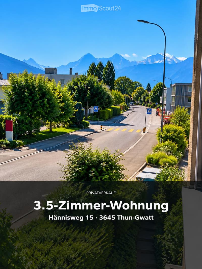 Residential street lined with trees and houses, with a clear view of mountains in the background.