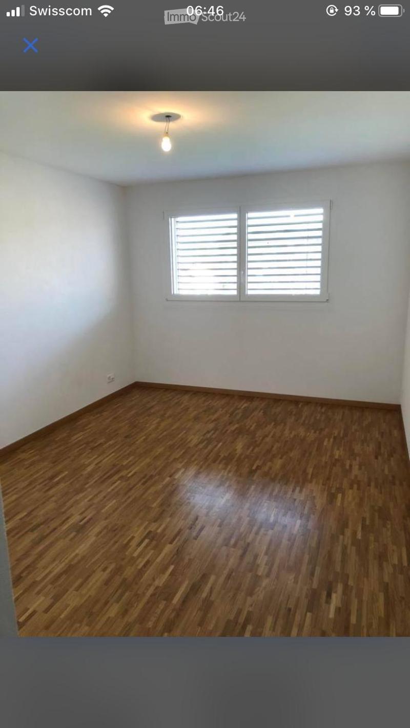 Empty room with wooden flooring, white walls, and a window with blinds. No furniture or equipment is present.