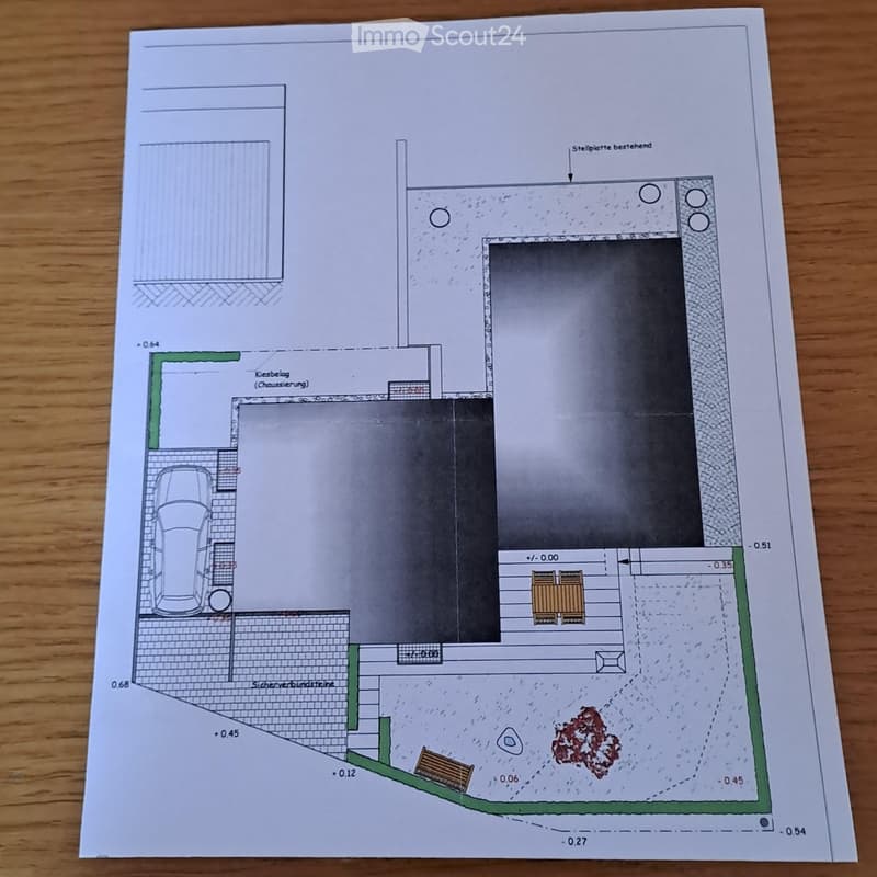 Floor plan showing a garage, raised ground floor, and parking area with detailed measurements and annotations.