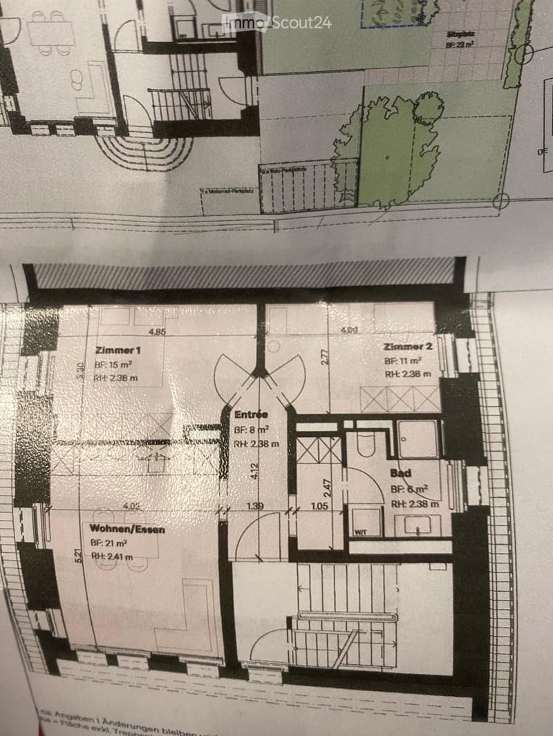 Floor plan of a residential unit showing a living/dining area, two bedrooms, a bathroom, and an entrance. Dimensions and room labels are provided.