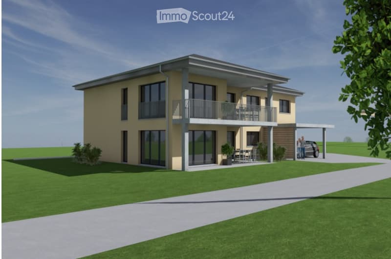 Two-story modern house with a balcony, large windows, and a parking area. The house features a light yellow facade and is surrounded by a well-maintained lawn.
