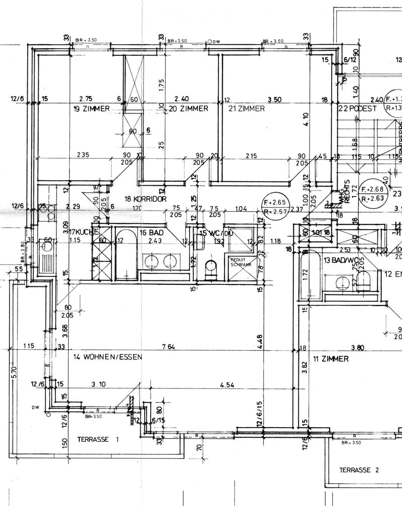 Floor plan showing multiple rooms including living/dining area, kitchen, bathrooms, bedrooms, corridors, and terraces.