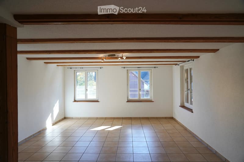 empty room, white walls, wooden beams, tiled floor, three windows