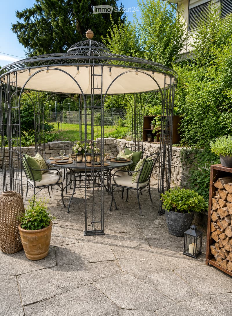 Outdoor patio with a metal gazebo, dining table with chairs, potted plants, and a wood stack.