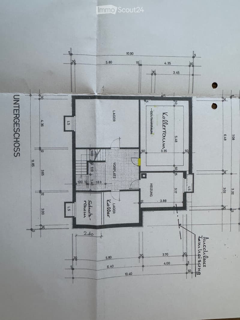 Floor plan of the basement level showing labeled rooms including storage, workshop, and heating area with dimensions and measurements.