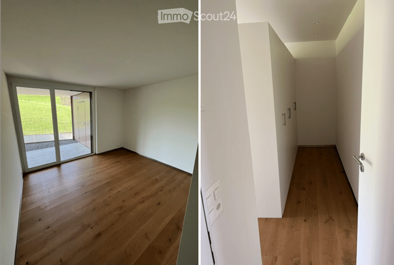 Empty room with wooden flooring, large glass sliding door leading to outdoor area, white walls, and visible electrical outlet.