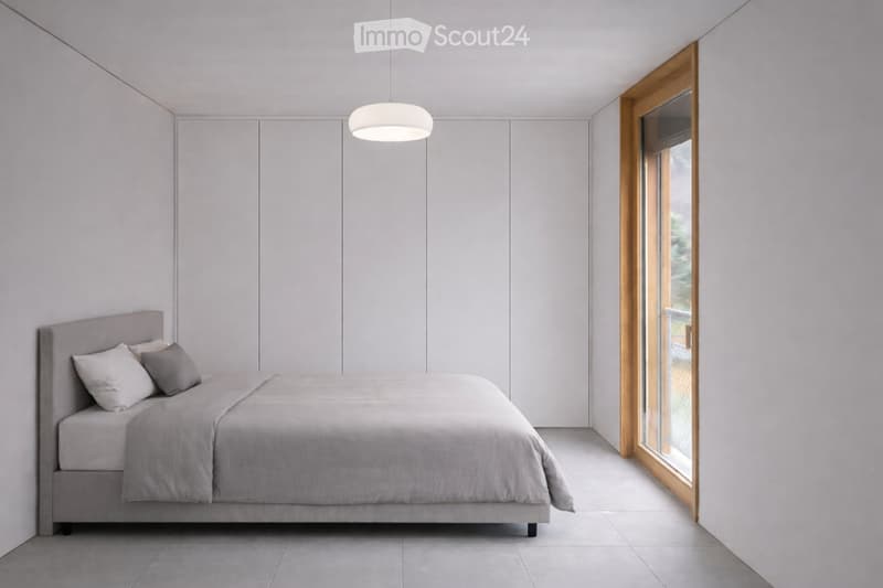 Modern, minimalist bedroom with a grey bed, matching pillows, and a sleek pendant light fixture. The room features light grey walls, a large window with wooden frame, and a clean, uncluttered design.