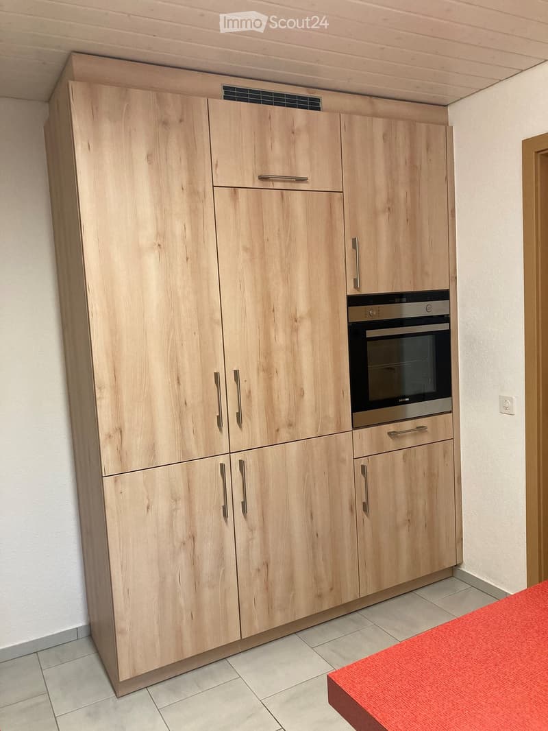 kitchen with wooden cabinets, built-in oven, white tiled floor