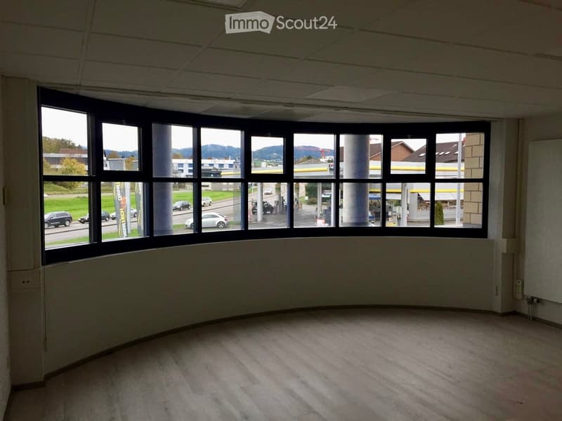 empty room, large windows, wooden floor, view of outside