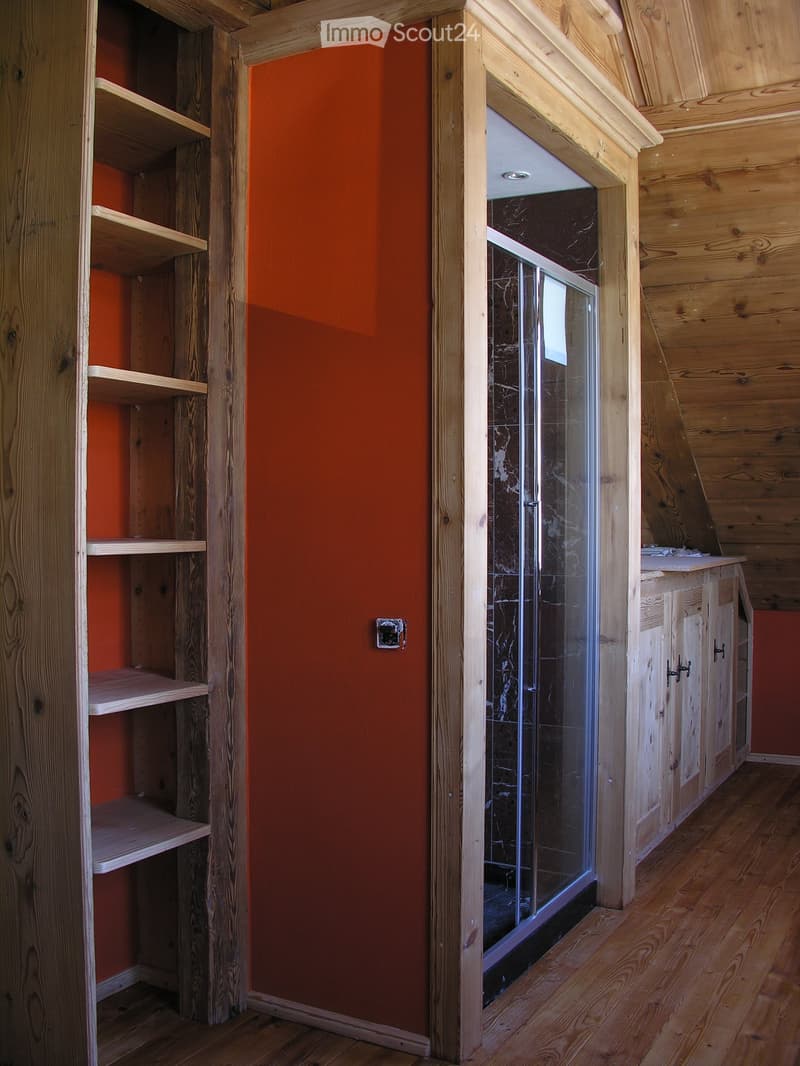 wooden floor, wooden ceiling, wooden wardrobe, orange wall, glass shower, wooden cabinet