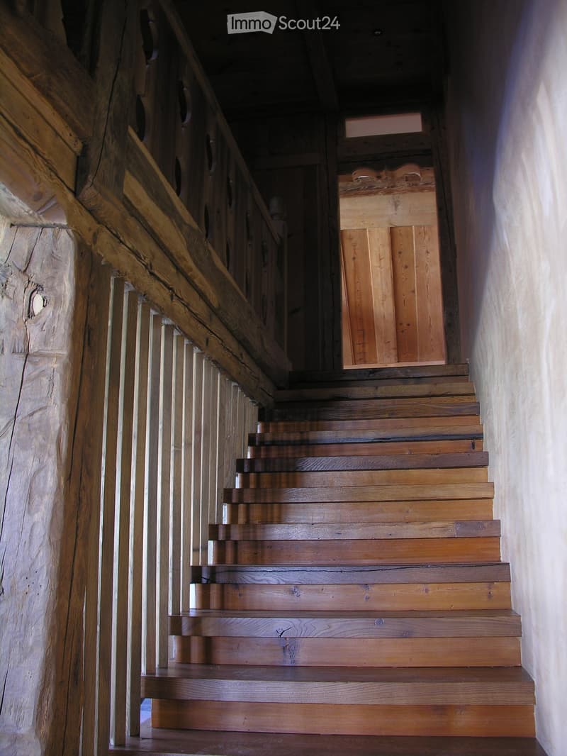 Wide staircase with wooden treads and risers