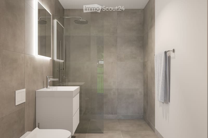 Modern bathroom with a white sink, mirror, glass-enclosed shower, and a towel hanging on a rack.
