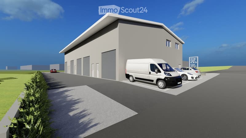 Modern industrial-style building with large garage doors, surrounded by a paved parking area with several parked vehicles, including a white van and a sports car.