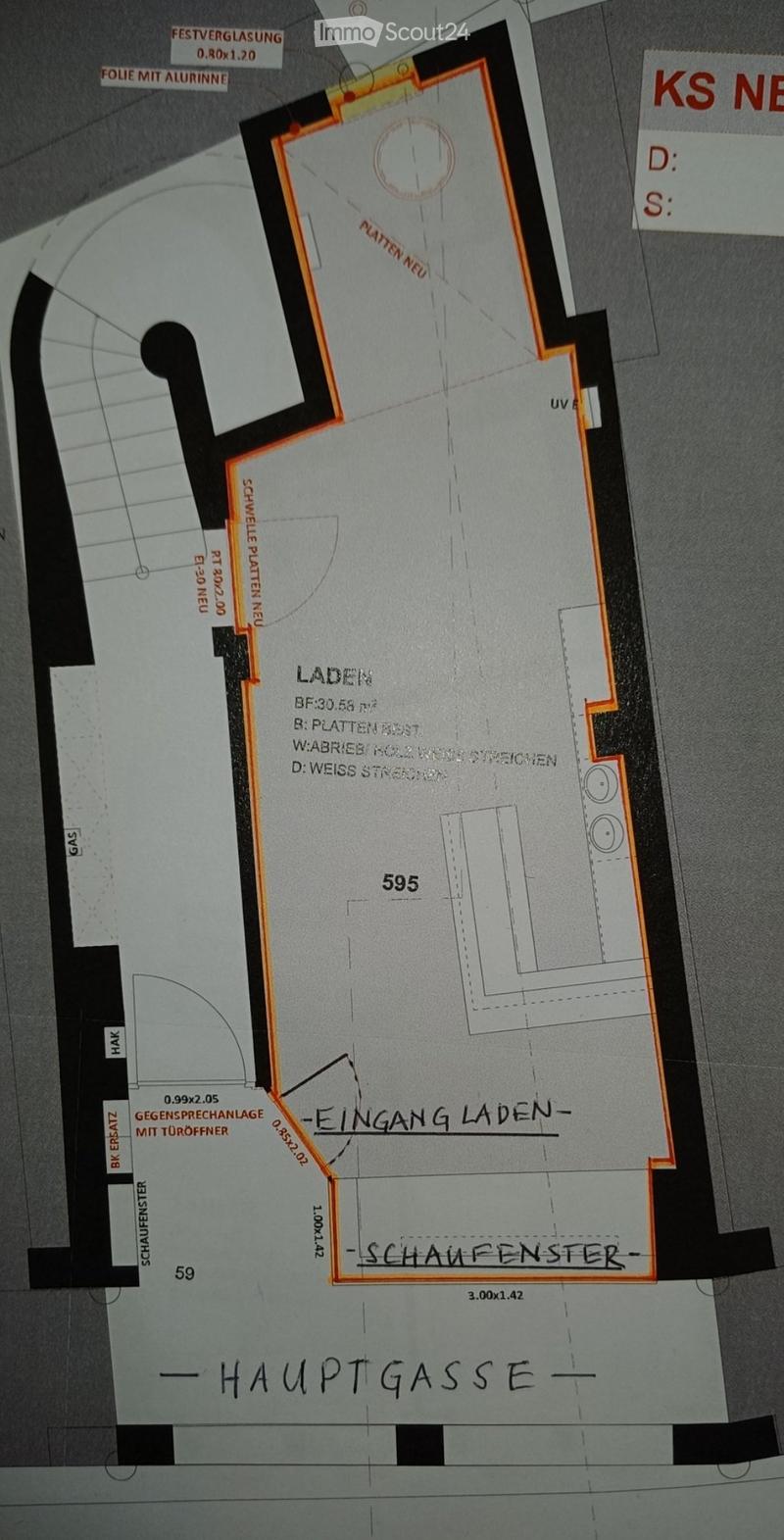 Floor plan of a commercial space with labeled areas including entrance, shop, and windows.