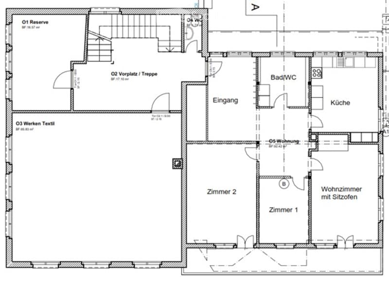 Floor plan of a house with multiple rooms including a living room with seating, two bedrooms, a kitchen, a bathroom, and an entrance area.