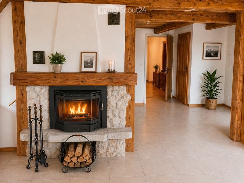 Cozy hallway with a stone fireplace, wooden beams, and potted plants, leading to another room.