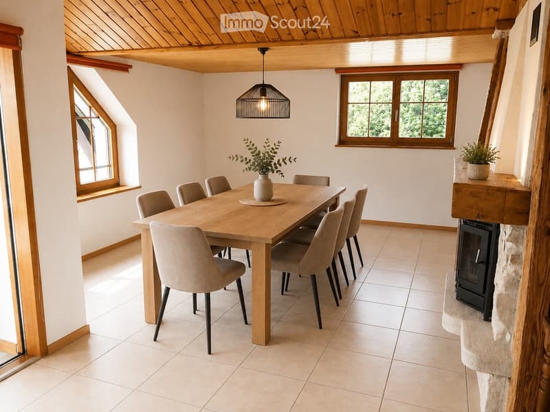 Bright dining area with a wooden dining table surrounded by six chairs, a pendant light fixture, a fireplace, and potted plants on the windowsill and side table.