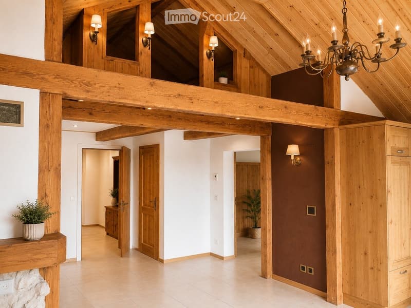 Spacious hallway with exposed wooden beams, warm lighting, and multiple doors leading to different rooms. Features a chandelier, potted plants, and a stone fireplace.