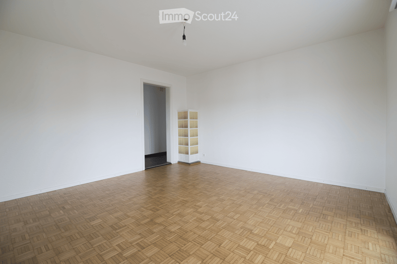 empty room, wooden floor, white walls, small shelf, open door