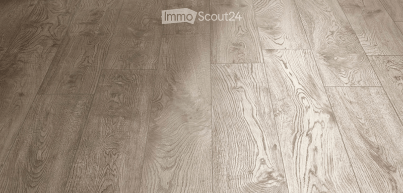 Empty room with wooden flooring, no furniture or equipment visible.