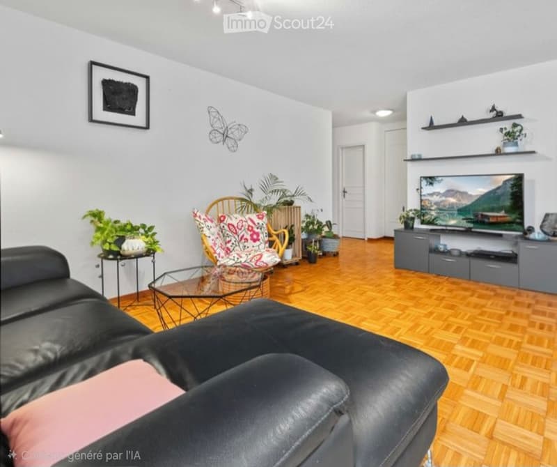 Modern living room with wooden flooring, black leather sofa, glass coffee table, colorful armchair, TV, and decorative plants.