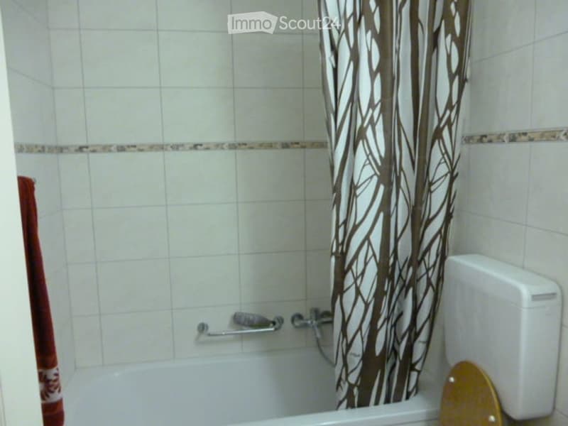 Bathtub, shower curtain, white tiles, toilet