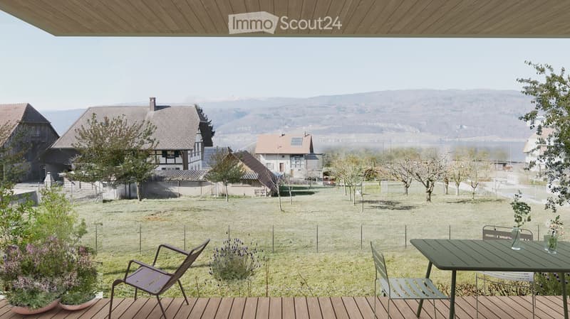 Garden, large grassy area, trees, plants, chairs, table, view of mountains and water
