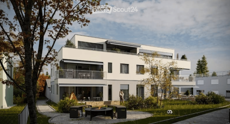 Modern two-story house with white facade, multiple balconies, and a landscaped garden area with outdoor seating and a fire pit.