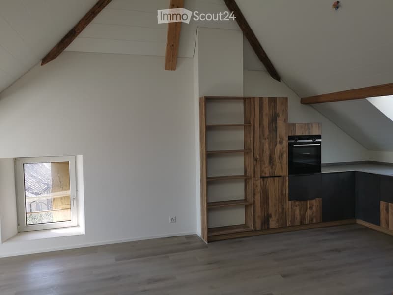 empty attic room, wooden beams, wooden shelf, built-in oven, window