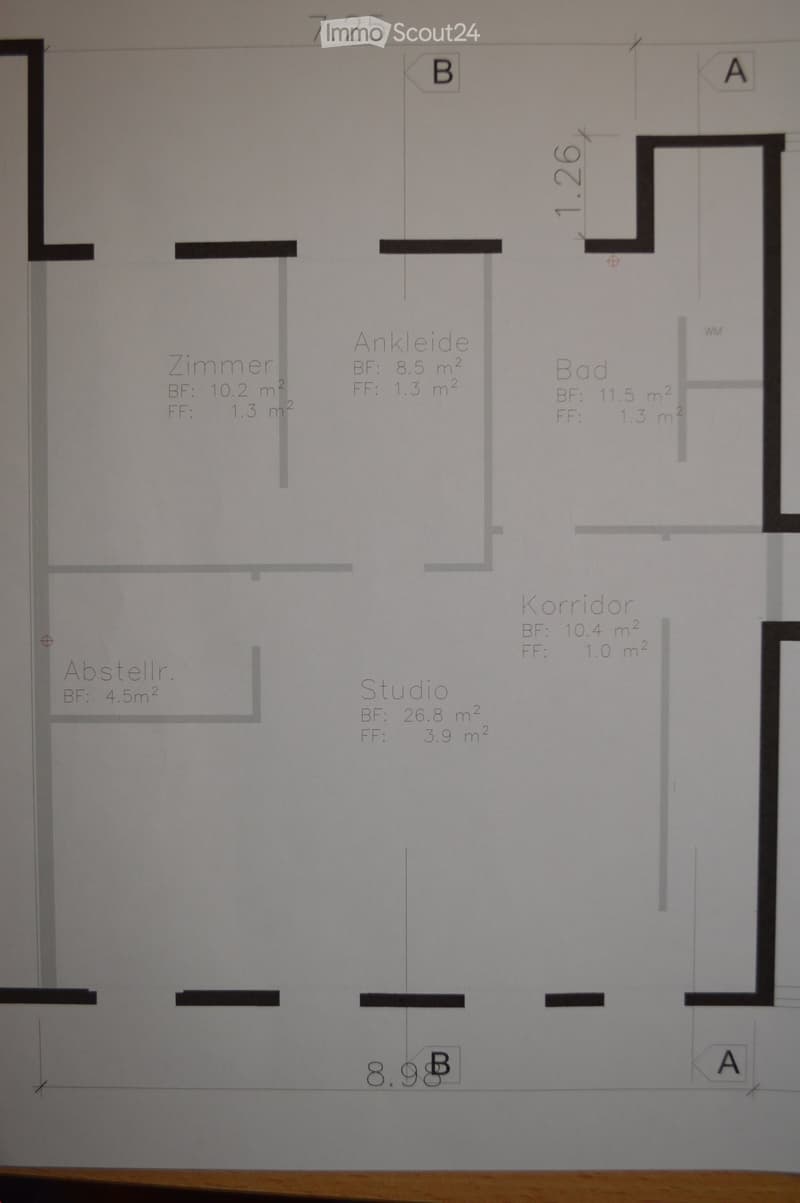 Floor plan showing a studio, bedroom, bathroom, hallway, and storage area with labeled dimensions and room names.