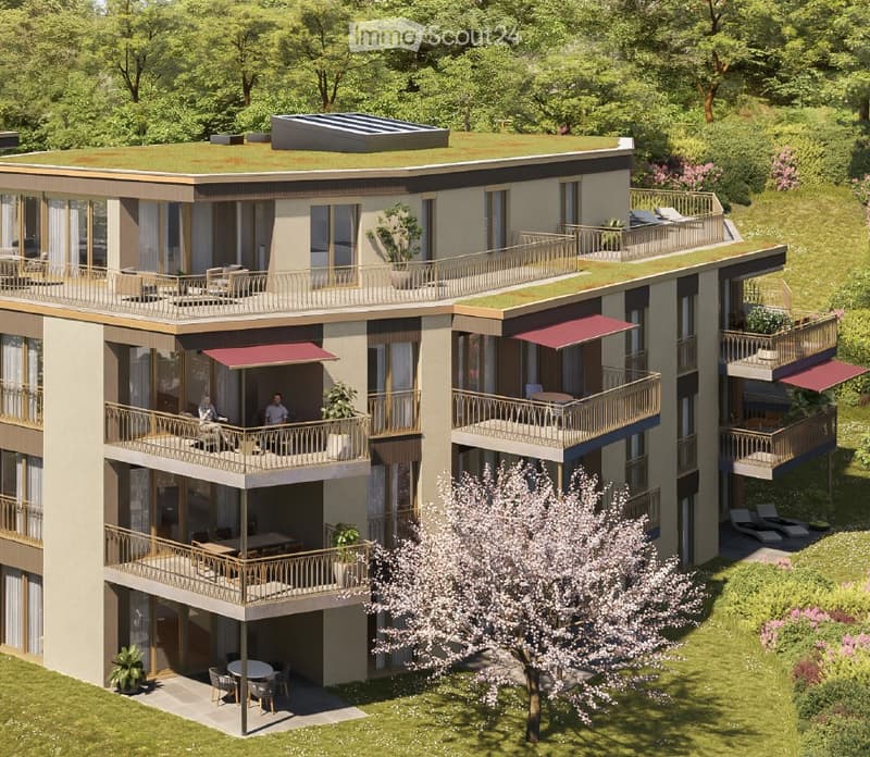 Modern multi-story residential building with balconies, terraces, and rooftop garden. Features large windows, contemporary design, and surrounding greenery.